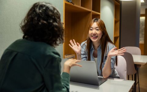 Colleagues at work in an office, representing the employment question